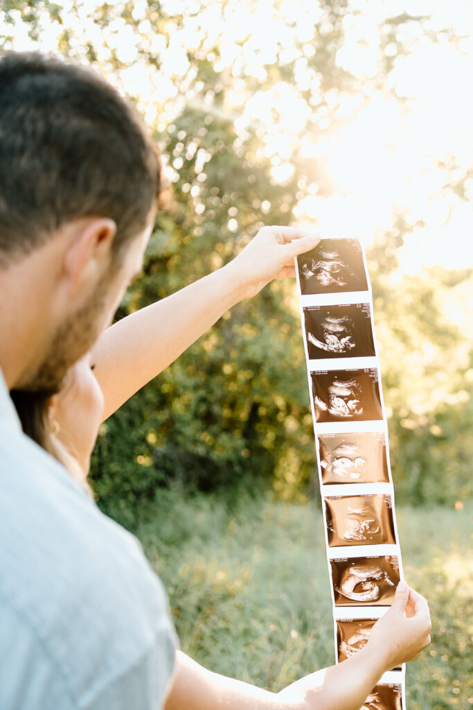 Baby boy announcement photo session with expecting parents in North Texas