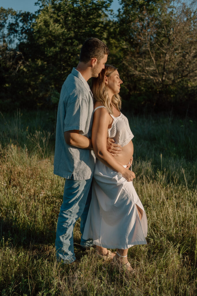 North Texas maternity photography session at Lake Grapevine with expecting parents announcing baby boy