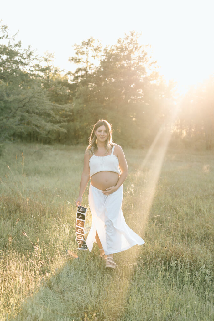 Expecting couple at 20 weeks pregnant posing for maternity photography session at Murrell Park Flower Mound Texas